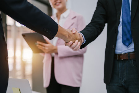 Close-up hand of Profession business people shaking hands, finishing up a meeting. Concept of successful business people shaking hands.の写真素材