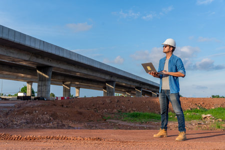 Asian expressway engineering inspected at road construction site. Civil Engineer.の写真素材