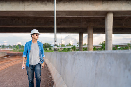 Asian architects inspected at road construction site.の写真素材