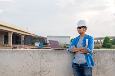Asian civil engineers working at road construction sites.の写真素材