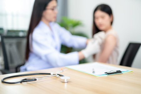 Blurred of Doctor making a vaccination in the shoulder of patient, Flu Vaccination Injection on Arm,...