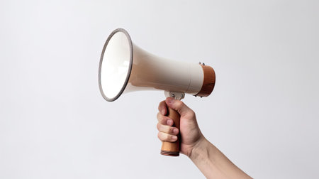 Hand of young man holding megaphone over isolated white background. Generative Aiの素材