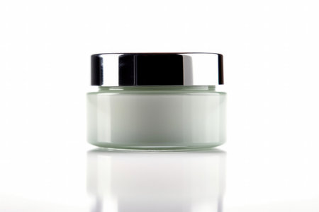 a Cosmetic cream jar on white background with reflection and shadow.の素材