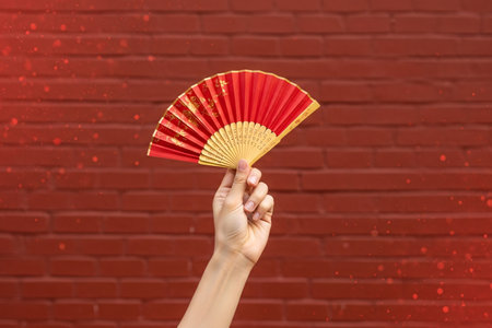 Red gold accessory for Chinese New Year celebration adds a touch of traditional oriental elegance to the scene.の素材