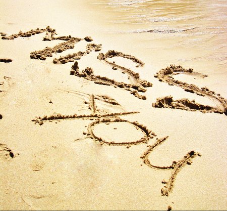 romantic words written on the sand on the beachの写真素材