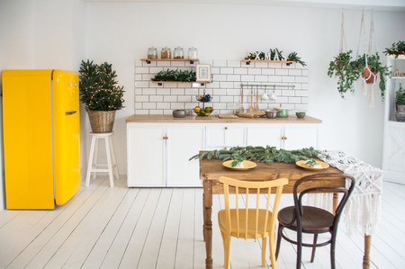 beautiful white modern kitchen interior,kitchenware, home style, with yellow fridge,loft style