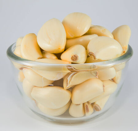 Garlic in a bowl, ready for cookの写真素材
