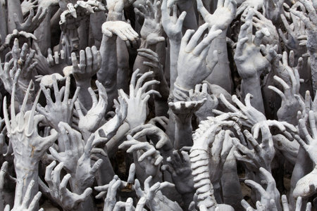 Hands Statue from Hell at White temple の写真素材