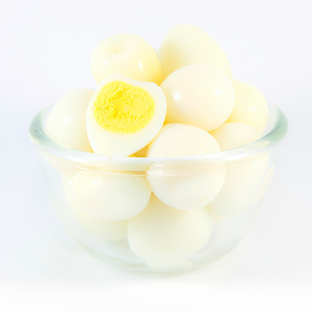 Boiled quail eggs on white background の写真素材