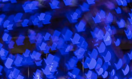 Bokeh image with blue arrow shapeの写真素材