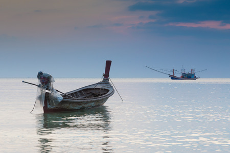 Beauty landscape of Long tail boat in the sea during twilight timeの写真素材