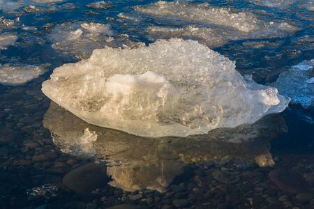 Ice on the shore of glacier lake, Icelandの写真素材