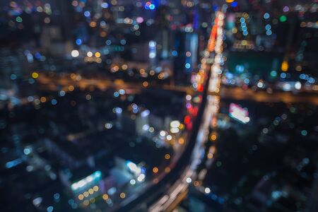 Abstract blur bokeh background of main junction traffic lights in Bangkok cityの写真素材