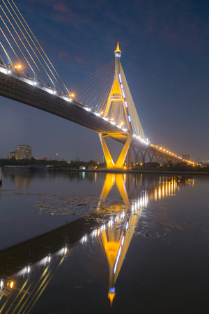 Bangkok Bridge with water reflection at nightの写真素材
