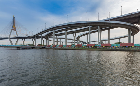 Industrial Ring road with suspension bridge river frontの写真素材