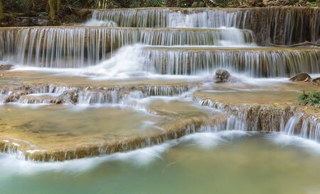 Nice water falls in deep forest of Thailandの写真素材