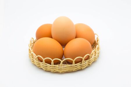 Eggs in basket collection on white backgroundの写真素材
