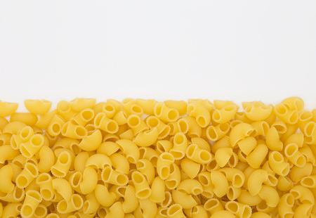 Raw macaroni on white backgroundの写真素材