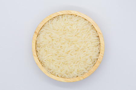 White long uncooked rice on white backgroundの写真素材