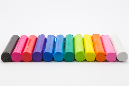 Art rainbow of clay colours, creative craft product on white backgroundの写真素材