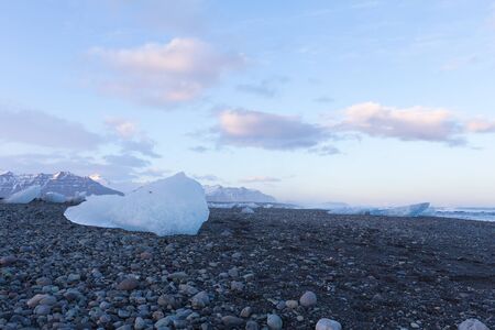 Ice on basalt black sands south of Iceland