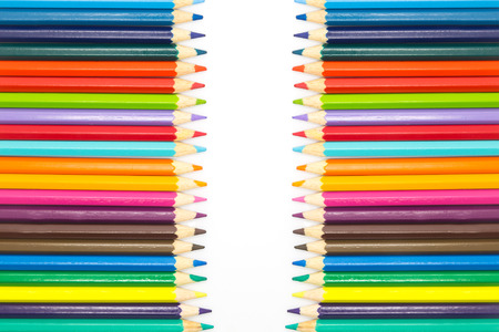 Row of multiple colors wooden pencils, on white backgroundの写真素材