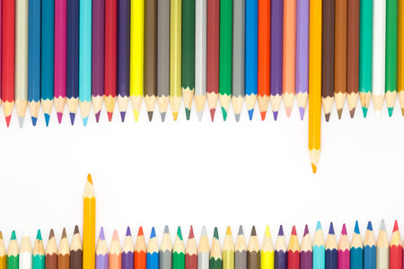 Line of multiple colours wooden pencils on white backgroundの写真素材