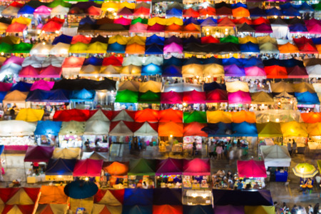 Blurred bokeh lights of aerial view colors flea market roof topの写真素材