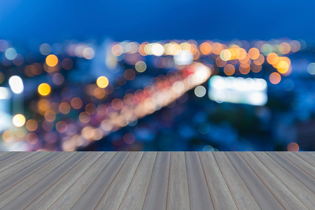 Opening wooden floor, Blur bokeh lights expressway curved during twilightの写真素材