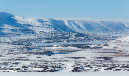 Beautiful of covered snow mountain on sunshine day, Icelandの写真素材