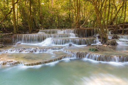 Beautiful landscape view of blue stream waterfalls in deep forest jungleの写真素材