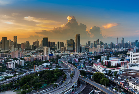 Beautiful skyline of cityscape with highway interchange during sunsetの写真素材