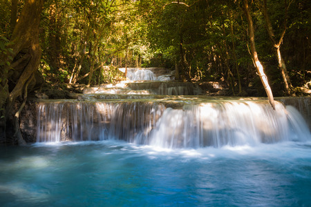 Deep forest blue stream waterfalls during spring seasonの写真素材