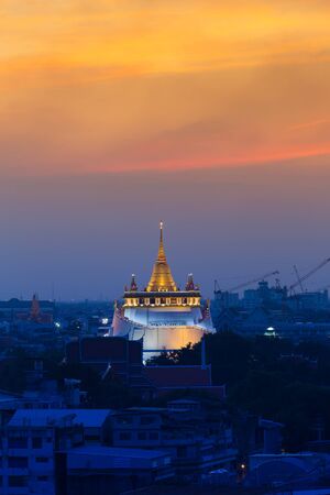 Dramatic sunset sky, Golden mountain temple the most famous Bangkok Landmarksの写真素材