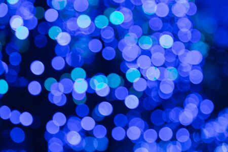 Blurred bokeh blue christmas lights backgroundの写真素材