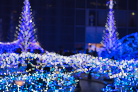 Abstract blurred bokeh lights christmas tree backgroundの写真素材