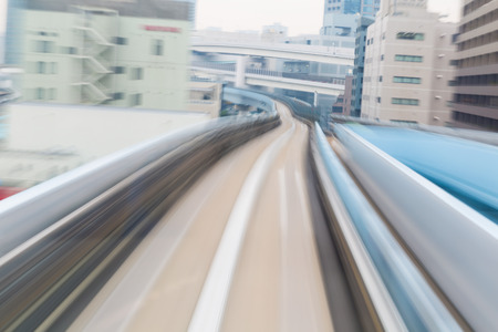 Motion blurred monorail moving in Tokyo city