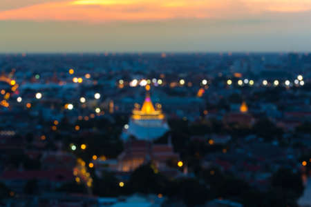 Abstract blurred bokeh lights, golden mount temple during sunsetの写真素材