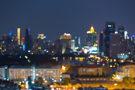 Night blurred lights city downtown, abstract bokeh backgroundの写真素材