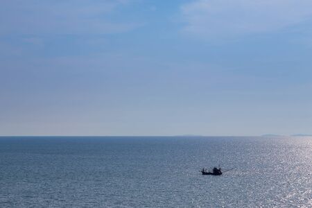 Little lonely fishing boat on the ocean, natural abstract backgroundの写真素材