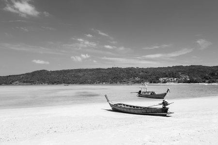 Black and White, Long tail Fishing boat on the beach, natural landscape backgroundの写真素材