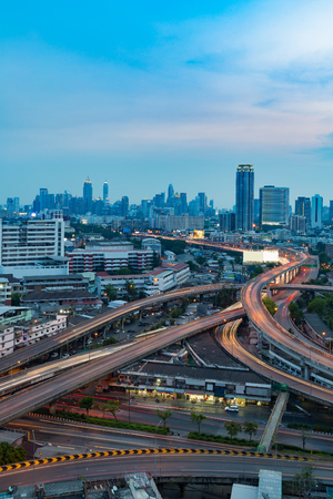 Highway interconnection with city downtown background, long exposureの写真素材