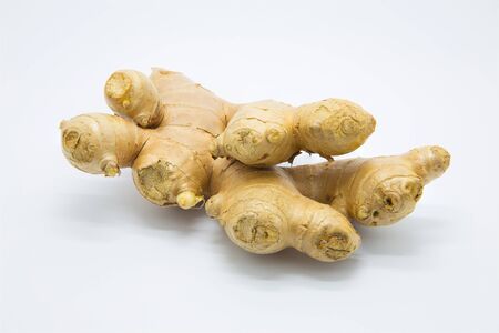 Root ginger on white backgroundの写真素材
