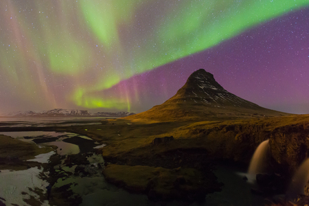 Northern lights night view over Kirkjufell volcano with fully of star on the sky, Iceland natural  landscape backgroundの写真素材