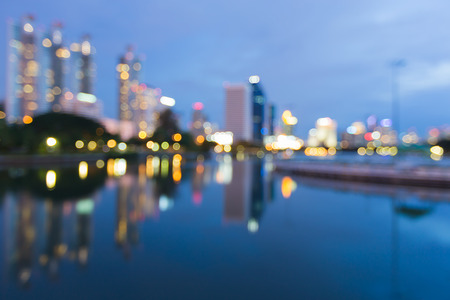 City blurred lights night view with reflection, abstract bokeh backgroundの写真素材