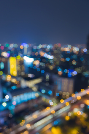 Twilight blurred light city office building, abstract backgroundの写真素材