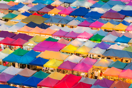 Multiple colours night market roof top, backgroundの写真素材