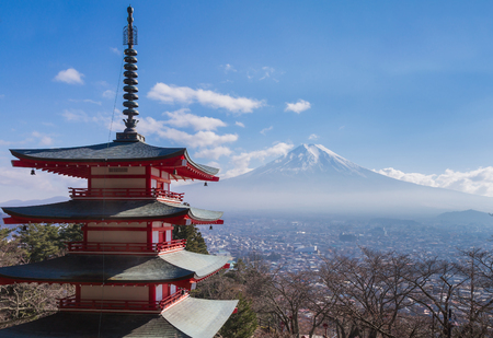 Mt. Fuji volcano viewed from behind red Chureito Pagoda, Japan during  winterのeditorial素材