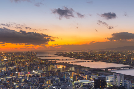 Osaka city aerial view with sunset sky backgroundの写真素材