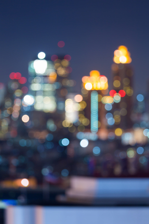 Abstract blurred bokeh lights city office building night viewの写真素材